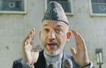 Afghanistans præsident Karzai vil både bede Bush om hjælp og større selvkontrol, når de to præsidenter mødes i dag. - Arkivfot:o: AP 