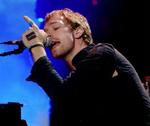 Coldplays forsanger Chris Martin under en koncert i New York for nylig. - Foto: AP 