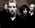 Det forhen lille studenterband Coldplay med de kønne melodier er på det nye album ved at drukne i en sovs af storladen produktion. - Foto: Kevin Westenberg 