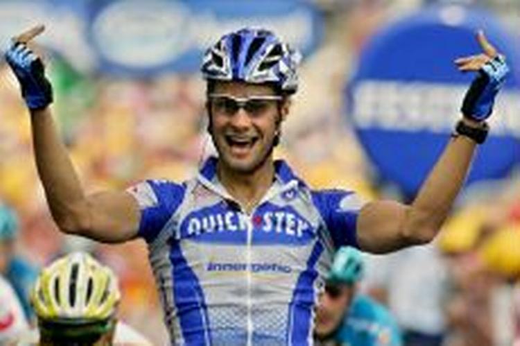 Tom Boonen fra Quick Step i flabet positur efter etapesejren. - Foto: AP 