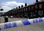 Tempest Road i Leeds. Politiet har ransaget flere af husene i gaden i jagten på spor efter terroristerne. - Foto: AP 