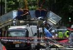 56 personer mistede livet ved angrebene 7. juli. Her vraget af bussen på Tavistock Square. - Foto: AP 