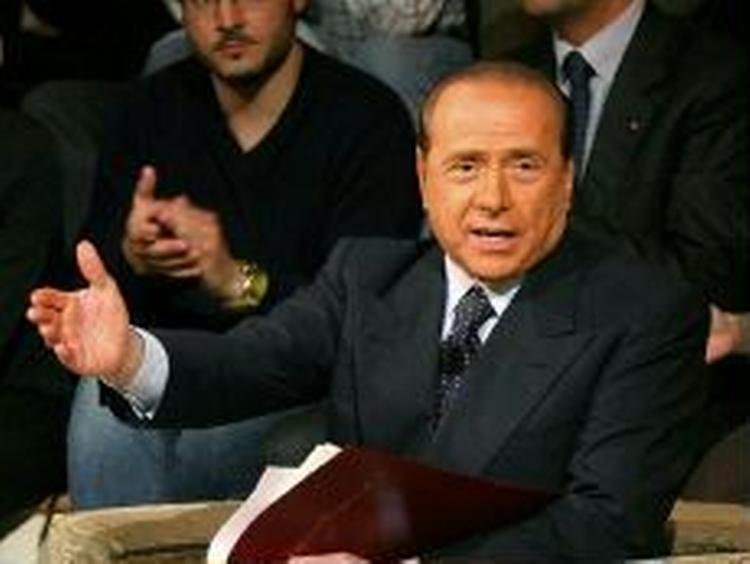 Lanes bog fortsætter i samme spor og dokumenterer punkt for punkt Berlusconis mørkeste sider. - Arkivfoto: AP 