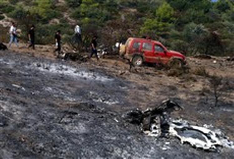 Redningsmandskabet fandt det forbrændte fly spredt over et større område.- Fotot Thanassis 