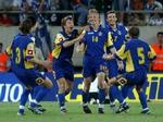 Ukraine-spillerne jubler efter en scoring mod Grækenland. - Arkivfoto: AP. 