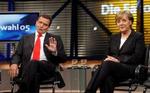 Tonen mellem Schröder og Merkel er blevet skarpere undervejs i valg-debatten - Foto: AP 