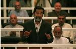 Saddam Hussein kalder retssagen mod ham for »uretfærdig«. - Foto: AP 