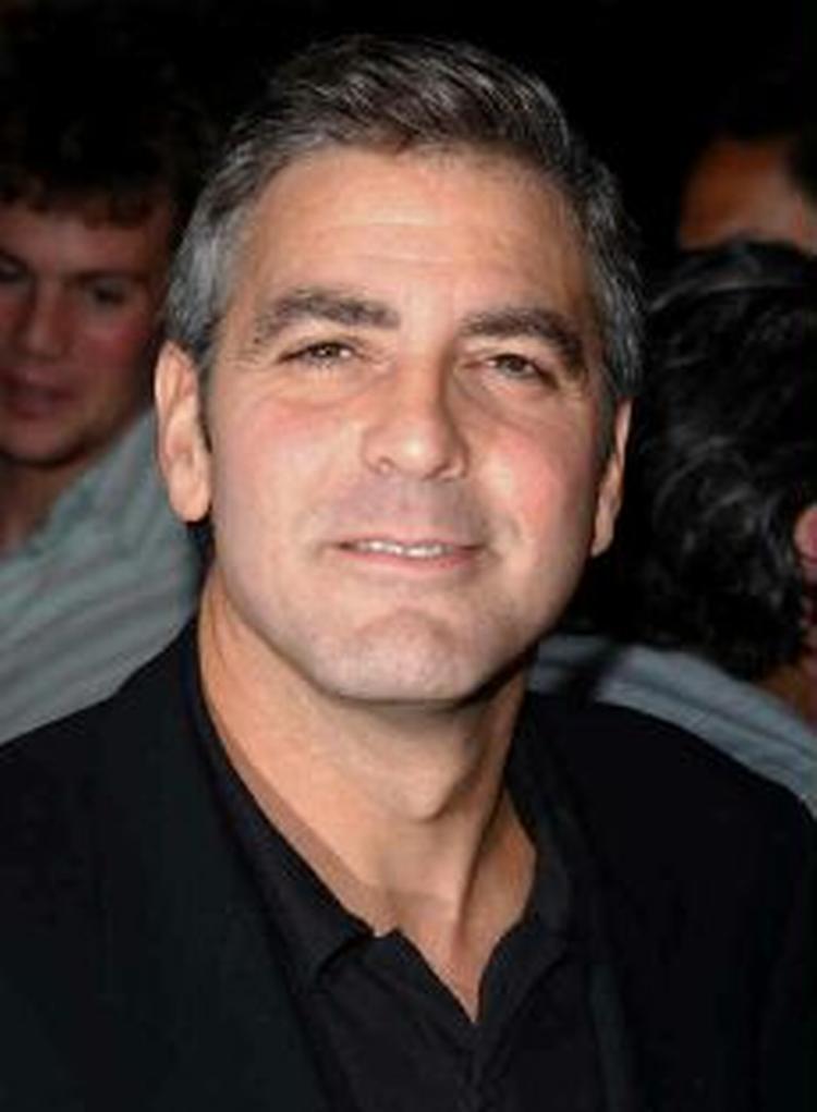 George Clooney afviser at være en slagsbror. - Arkivfoto : AP 