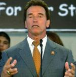 Arnold Schwarzenegger er taget til Kina for at stoppe piratkopiering - Foto: AP 