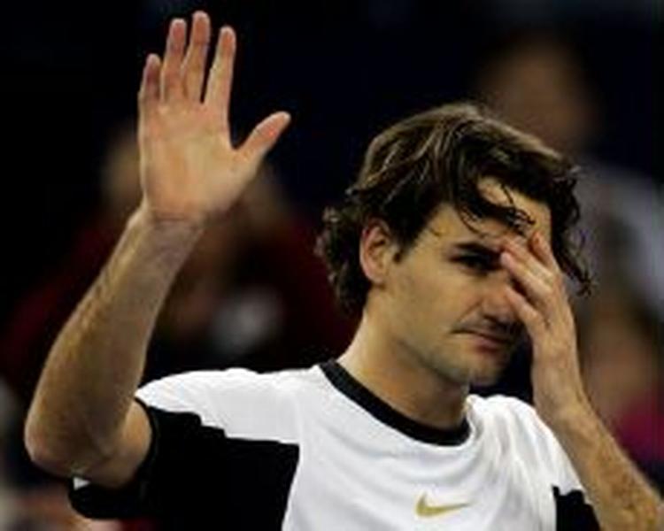 Federer gav Gaston Gaudio læsterlige klø. - Foto: AP 