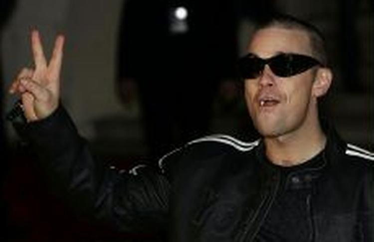 Robbie Williams er godt på vej til at blive alle tiders britiske popidol. - Foto: AP 