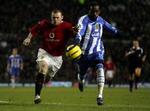Manchester Uniteds Wayne Rooney (tv) var den store oplevelse i kampen mod Wigan, hvor han scorede to mål i 4-0-sejren. - Foto: AP 