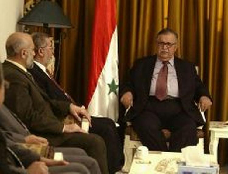 Iraks præsident, Jalal Talabani (th.), mødtes med repræsentanter fra oppositionen. - Foto: AP 