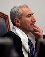 Dommeren i Saddam-sagen, Rizgar Mohammed Amin, er under pres for at vende tilbage i dommerstolen. - Arkivfoto: AP 