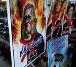 Demonstranter i Gaza med plakater af Bush, Olmert og Fogh i protest mod Muhammed-tegninger. - Foto: AP 