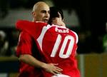 Hossam Hassan og Emad Moteab jubler efter en egyptisk scoring. - Foto: AP 