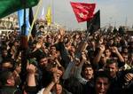 Vrede shiamuslimer fylder gaderne i Bagdad. - Foto: AP 