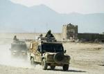 Britiske tropper patruljerer uden for Policharki fængslet ved Kabul, hvor et fire dage langt fangeoprør i dag blev afsluttet. - Foto: AP 