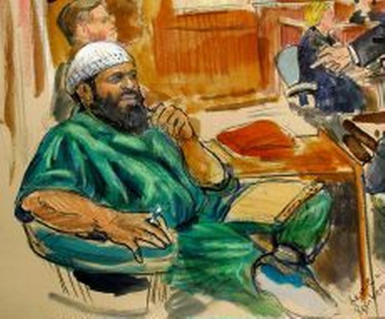 Zacharias Moussaoui blev siddende i sin stol, da dommen blev læst op. - Tegning: AP 