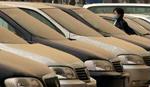 Sandfarvede biler i Beijing. - Foto: AP 