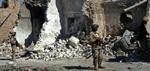 Irakiske soldater i Tal Afar nord for Bagdad, der i går blev ramt af et bombeangreb. - Foto: AP 