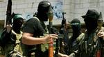 Gaderne i Gaza myldrer med forskellige militære grupperinger. Her er en gruppe militante Hamas-tilhængere, som ikke er del af den officielle sikkerhedsstyrke. - Foto: AP 