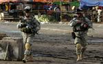 Soldater fra den amerikanske eliteenhed 101st Airborne patruljerer i Irak. Flere belastende sager har sat elitesoldaterne i et uheldigt lys. - Arkivfoto: AP 