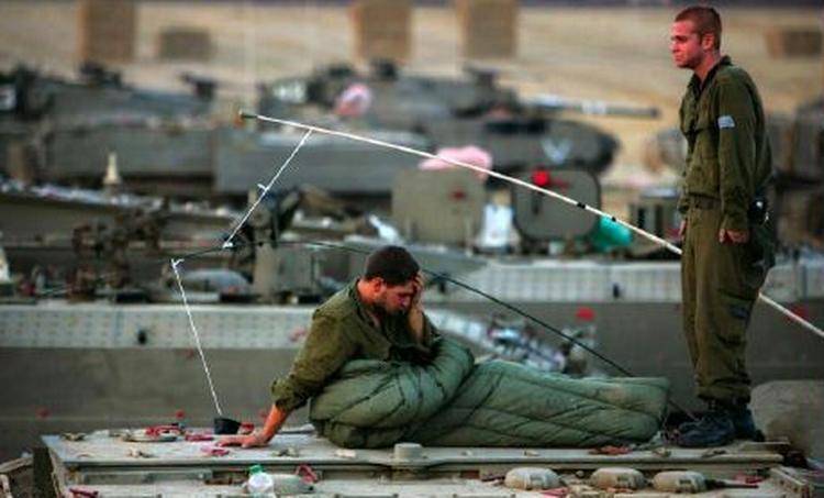 Israelske tropper er klar til indsats ved Gaza-striben. - Foto: AP 