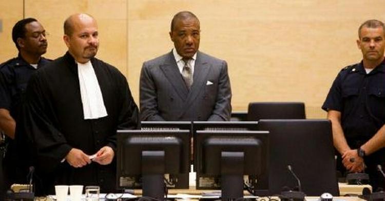 Charles Taylor under det første retsmøde. Hvis han bliver dømt, kan han komme til at afsone i Storbritannien. Danmark var blandt de lande, der sagde nej tak. - Foto: AP 