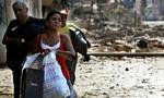 Libanesere flygter fra det sydlige Beirut efter nye bombardementer. - Foto: AP 