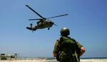En israelsk helikopter lander i Haifa med sårede soldater. FN's sikkerhedsråd har i dag fordømt Israels angreb på en FN-kontrolpost tirsdag. - Foto: AP 