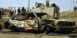 Her ses resultatet af en tidligere bilbombe i Mosul. - Foto: AP 