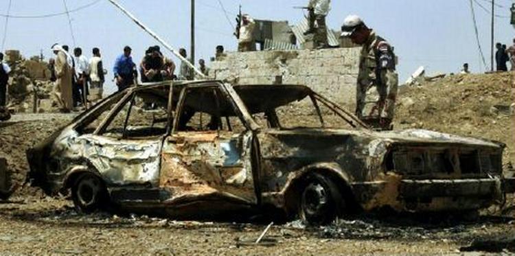 Her ses resultatet af en tidligere bilbombe i Mosul. - Foto: AP 