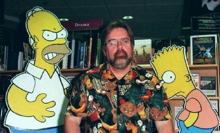 Skaberen af 'Simpsons', Matt Groening, ses her sammen med nogle af de fire-fingrede, gule personer fra den populære tegneserie. - Arkivfoto: AP 