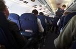 Steward anmeldte flypassager for klap i numsen. 