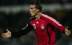 Podolski scorede to gange for tyskerne. 