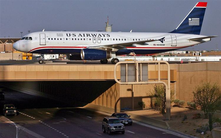 Personalet på et US Airways fly reagerede kraftigt på bedende imamer. 