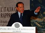Tidligere ministerpræsident Silvio Berlusconi ses her under et partimøde i september. 