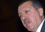 Den tyrkiske ministerpræsident Recep Tayyip Erdogan raser mod EU's beslutning om at fastfryse dele af Tyrkiets forhandlinger. 