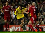 Arsenals Tomas Rosicky scorede to smukke mål, da Liverpool fik stryg på hjemmebanen og røg ud af FA Cuppen. 