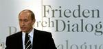 Med ordene 'fred' og 'dialog' i baggrunden holdt putik tale i München i dag. 