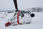 Den forulykkede helikopter fotograferet af en af passagererne. 
