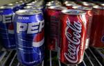 Verdens to colagiganter indgik et sjældent samarbejde i sagen om den uærlige Coca-Cola ansatte. 
