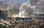 En bygning under angreb i Nahr al-Bared-lejren i Libanon. 