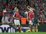 Christian Poulsen får rødt efter at have slået Markus Rosenberg. UEFA's appeludvalg har valgt at lempe dele af straffen. 