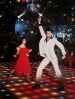 John Travolta dansede sig i 1977 i filmen 'Saturday Night Fever' til kultstatus. Nu er gulvet under ham sat til salg. - Foto: AP 