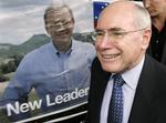 Den konservative premierminister John Howard bliver valgets store taber. 