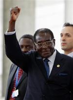 Zimbabwes leder, Robert Mugabe, mener, Anders Fogh Rasmussen er del af en 'firebande', der er Storbritanniens talerør. 