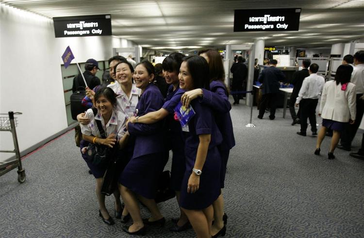 Smile kan de stadig væk, stewardesserne på Thai Airways. 
