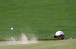 Med dette bunkerslag på 17. hul sikrede Tiger Woods sig en afgørende birdie. 